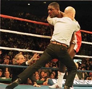 Mills Lane stops the fight as Bruno struggles to his feet after being knocked out Mills Lane stops the fight as Bruno struggles to his feet after being knocked out