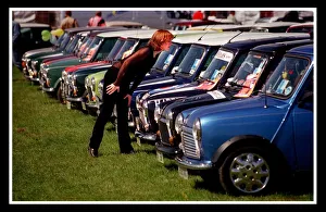 Mini car August 1999 Woman looking at blue Minis Mini cars are at Silverston for 40th Mini car August 1999 Woman looking at blue Minis Mini cars are at Silverston for 40th