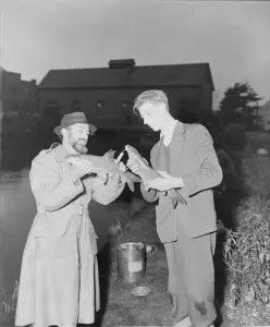 00002 Prints: DM Anglers Print: Men Comparing Fish, March 1952