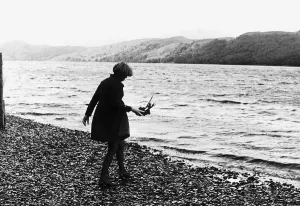 00003 Prints: Tonia Bern Campbell Print: A Woman Laying a Wreath by the Water