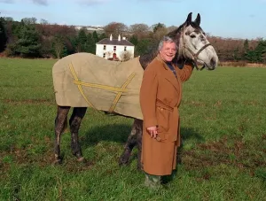 00009 Prints: Oliver Reed Print: Actor in Brown Coat with Horse Bobby in Irish Field