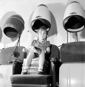 00012 Prints: Young girl under hairdryer print, August 1952