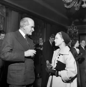 00026 Prints: Vintage Print of Woman in Long Coat at Cocktail Party