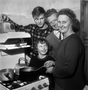 00027 Prints: A black and white print of a family in their home