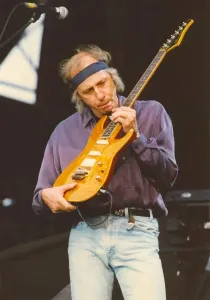 Prints of Dire Straits frontman Mark Knopfler performs with the group at Gateshead International Stadium. 14/06/92 0000to0099 Prints: Mark Knopfler Live at Gateshead Stadium Print