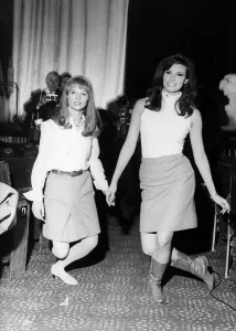 00029 Prints: Julie Christie and Raquel Welch Curtsying Print 1966