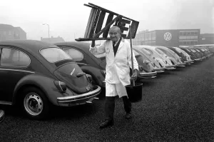00030 Prints: Black and white print of 91-year-old man working on a VW Beetle