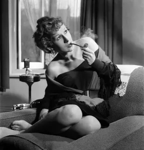00032 Prints: Gaby Silraire Print: A 1953 Photograph of a Woman Smoking a Pipe