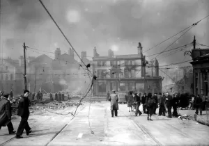 Prints of World War Two Air Raid Damage Liverpool Bomb damage at Liverpool, civilians walking under damage power lines after the blitz © dm op222f 0000to0099 Prints: World War Two Air Raid Damage Print at Liverpool
