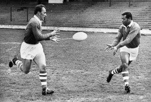 00034 Prints: A black and white photograph print of two football players in full kit