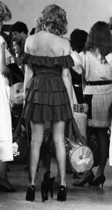 00034 Prints: Woman in a strapless black dress with a cat. Print, May 1983