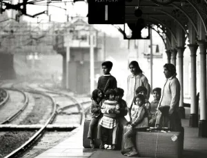 00035 Prints: Asian immigrant family waiting at Bishops Stortford train station Print