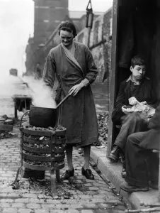 00035 Prints: Print of a woman cooking on a brazier