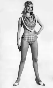 Vintage Beachwear Prints: Woman wearing a bikini with unusual neckscarf. June 1962 P011069