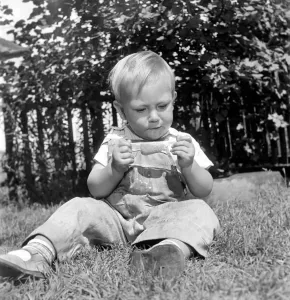 00037 Prints: A 2-year-old boy holds a melting lollipop print