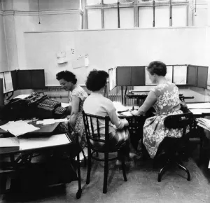 00038 Prints: Black and white print of cashiers calculating tax on wages