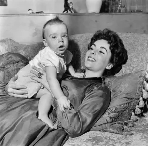 00039 Prints: Elizabeth Taylor at Home with Baby Michael Print, 1953