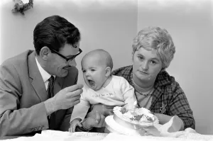 00039 Prints: Baby Sean Galley with parents nears first birthday, December 1969