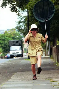 00040 Prints: Dylan Dronfield Print - Safari-Clothed Reporter in Big Game Hunting Scene