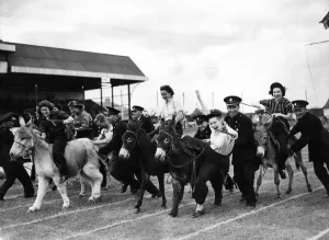 00041 Prints: Print of girls participating in a donkey derby, August 1943