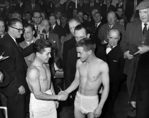 00042 Prints: John Caldwell shakes hands with young boxer at weigh-in, 1960 Print