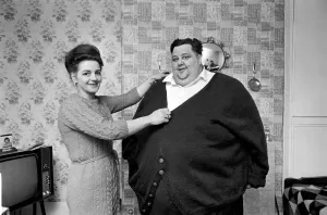 00044 Prints: Print of a woman knitting a cardigan for the world's fattest man