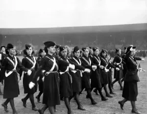 00048 Prints: Print of a 1950 photograph showing Church Girls in uniform marching past a saluting base