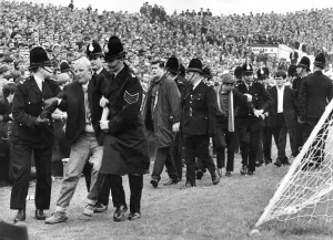 00049 Prints: Police Escort Fans at Manchester City v Liverpool, August 1967 Print