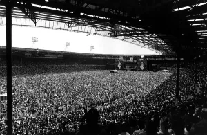 Prints of Live Aid Concert in aid of the Feed the World campaign for the starving millions in Africa, Where music stars performed many songs for charity, uncluding Status Quo, Queen, Phil Collins 0000to0099 Prints: Live Aid Concert Print: Wembley Stadium 1985