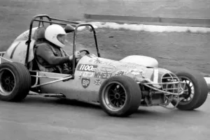 00055 Prints: Mini Grand Prix Print: Graham Hill at White City Stadium, March 1975