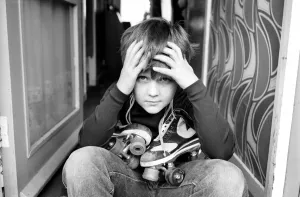 00062 Prints: Print of a 9-year-old boy in roller skates after hospital discharge