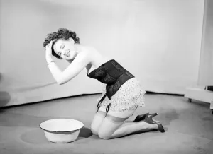 00064 Prints: 1959 Woman Wearing Corset Washing Hair Print (00064)