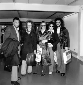London Airport Arrivals Prints: Steve Harley (3rd left) and Cockney Rebel. Seen here at London Airport arriving back