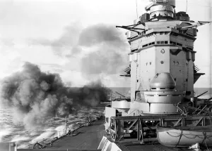 00073 Prints: HMS Rodney Print: British Battleship Firing Secondary Armament at Sea