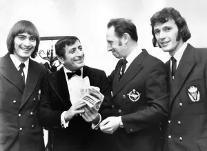 00086 Prints: Print of three sky-divers handing over £381 to Tony Bennett