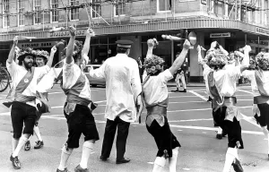 Prints of Morris dancers enterraining a traffic warden in Newcastle in 1976 Dance Prints: Morris Dancers Entertain in Newcastle Print 1976