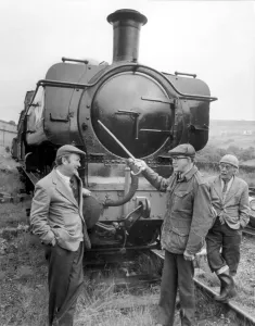 Prints of Last of the Summer Wine actors Brian Wild who plays Foggy Dewhirst, Peter Sallis (Norman Clegg) and Bill Owen (Compo Simmonite) out anad about at Oakworth station in Yorkshire 0100to0199 Prints: Last of the Summer Wine Print - Oakworth Station 1979