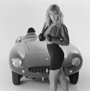 Vintage Fashion Photography Prints: Glamour model Caroline Delahunty poses next to a Ferrari. 19th April 1988