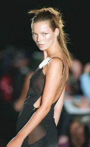 90s Fashion Models Prints: Kate Moss supermodel models Versace during Paris Fashion Week Black dress