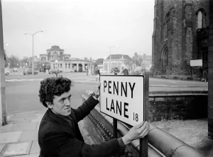 Prints of Bill Carrington holds Penny Lane Street Sign in Liverpool made famous by The Beatles March 1967 Liverpool Prints: Bill Carrington Holds Penny Lane Street Sign Print 1967