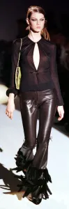 Retro Clothing Trends Prints: A model models at the Face of Guccis Fashion Show March 1999 wearing a
