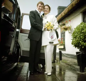 Prints of Arsenal and Northern Ireland footballer Terry Neill with his bride Sandra Litchfield after their wedding ceremony in his home town of Bangor, County Down November 1969 0200to0299 Prints: Terry Neill Print - Wedding Photo 1969