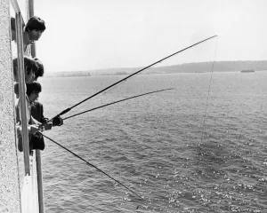 Prints of The Beatles do a spot of fishing from their hotl room in Seattle Washington 22nd August 1964. They did not catch anything but had some fun trying. The Beatles American Tour August - September 1964 0200to0299 Prints: The Beatles Fishing Print, Seattle 1964