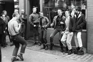 Prints of Teenage Skinheads dancing the Moonstomp outside a shop in London. 29th March 1980 Art Prints: Teenage Skinheads Dancing the Moonstomp Print, London 1980