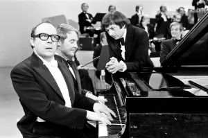Prints of Andre Previn, Guest Stars on the Morecambe and Wise Show, 7th December 1971. The show aires Christmas Day. Pictured during rehearsals with Eric Morecambe and Ernie Wise 0400to0499 Prints: Andre Previn Rehearsal Print, Morecambe & Wise Show 1971