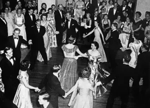 Prints of Queen Elizabeth II, Princess Elizabeth dances arms linked with Lady Pamela Mountbatten and the Duke of Edinburgh during an eightsome reel at The Saddle Club Dance, Malta. December 1949 Dance Prints: Queen Elizabeth II Eightsome Reel Print 1949