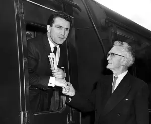 Prints of ABA middleweight champion Willie Stack, of Leamington Boys Club, is wished good luck by his father before leaving Leamington to box for England in internationals held in Hungary. 13th August 1964 Hungary Prints: Willie Stack Leaving for Hungary Print 1964