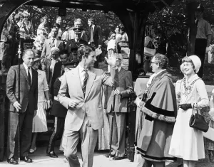 Prints of Prince Charles waves to the crowds after visiting Marton Church where he saw the records of the baptism of Captain Cook, during the Royal Tour of Cleveland. 1st June 1978 Cleveland Prints: Prince Charles at Marton Church, 1st June 1978 Print