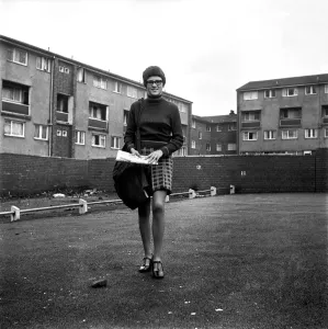 Prints of Teenage girl from Toxteth in Liverpool, Merseyside, delivering newspapers on a paper round. December 1969 Z12115 0500to0599 Prints: Liverpool Teenage Girl on Newspaper Round, 1969 Print