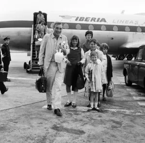London Airport Arrivals Prints: Spike Milligan and family back from a three week holiday in Marbella